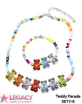 A matching necklace and bracelet set featuring colorful round beads and translucent teddy bear charms in multiple colors, shown on a white background with a Legacy Jewelry & Accessories logo and product code text.