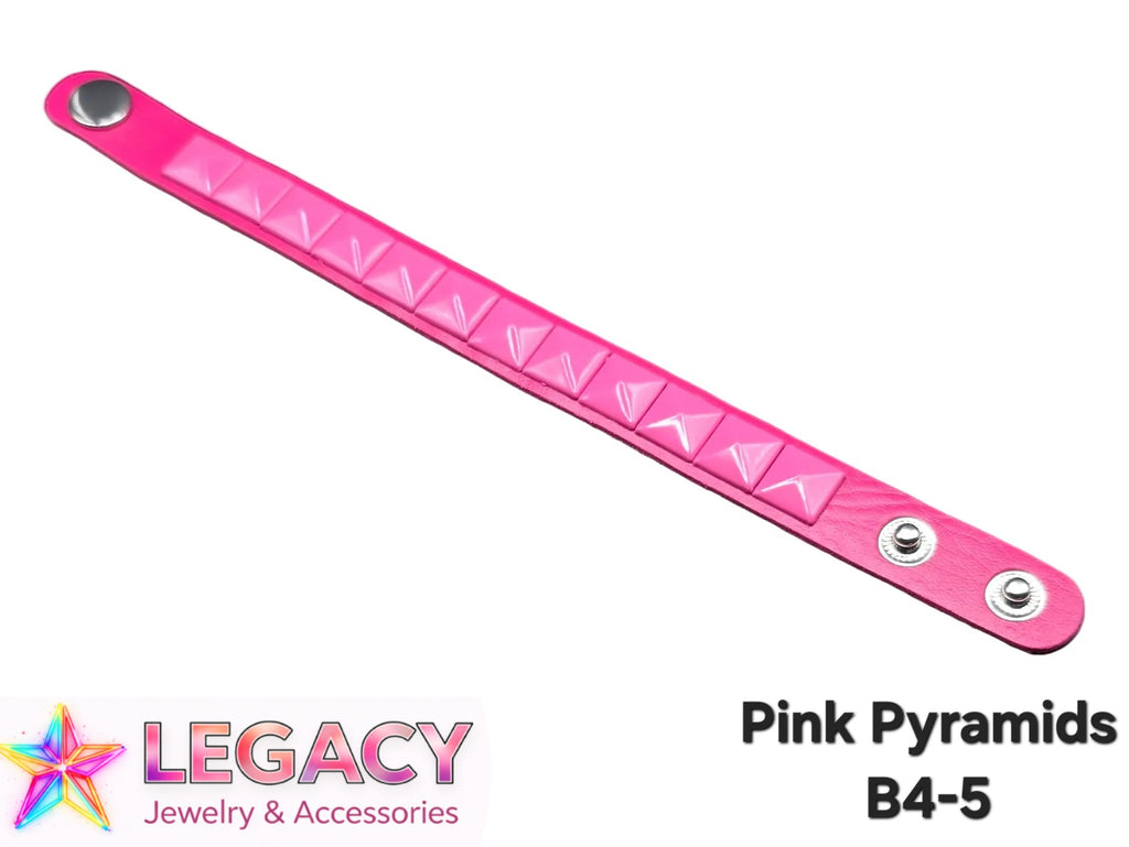 A pink leather bracelet featuring a row of pyramid studs along the center, shown diagonally on a white background with 'LEGACY Jewelry & Accessories' and 'Pink Pyramids B4-5' text overlays.