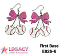 A pair of dangling earrings shaped like cherry baseballs with pink bow tops, shown on a white background with the text 'First Base E826-6' and a 'Legacy Jewelry & Accessories' logo.