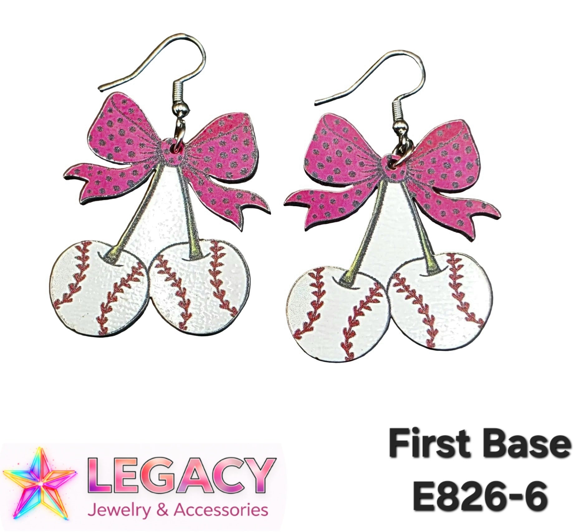 A pair of dangling earrings shaped like cherry baseballs with pink bow tops, shown on a white background with the text 'First Base E826-6' and a 'Legacy Jewelry & Accessories' logo.