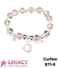 A beaded stretch bracelet with pink and clear faceted beads, silver-toned metal links, small star charms, and a crescent moon charm with a star, shown on a white background with 'LEGACY Jewelry & Accessories' and 'Curfew B11-6' text.